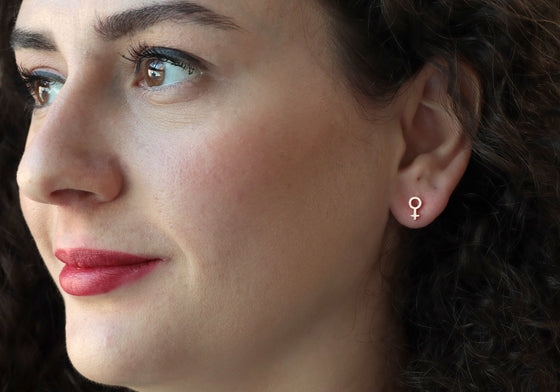 Female symbol earrings