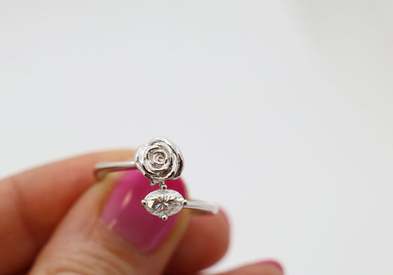 Romantic ring with a rose and a moissanite